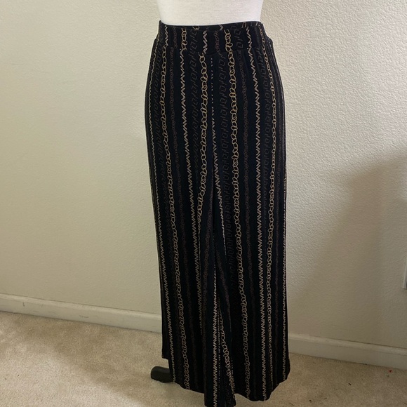 Chicos Travelers Black Stretch Pants With Gold Geometric Print - Picture 1 of 5